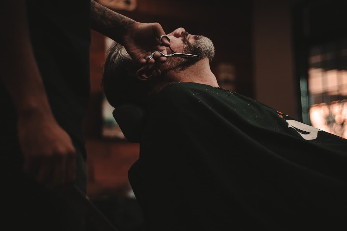 A client in the chair mid-cut